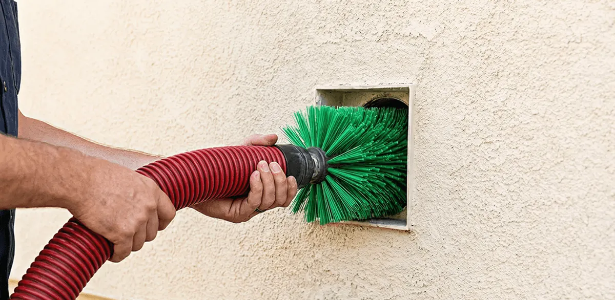 Air duct cleaning brush removing debris from a vent opening in Seattle, WA
